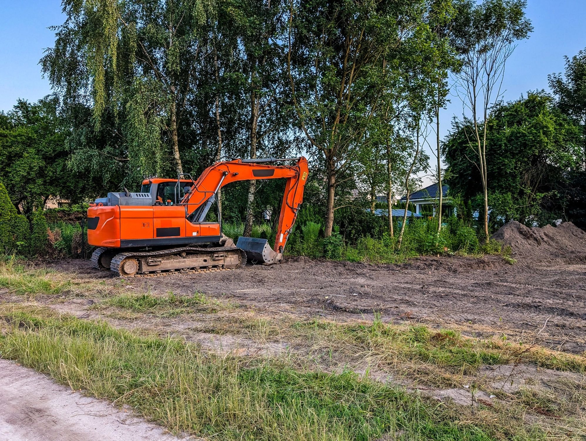 Orange excavator on construction site